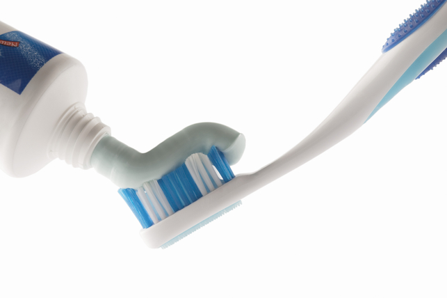 toothbrush receiving toothpaste